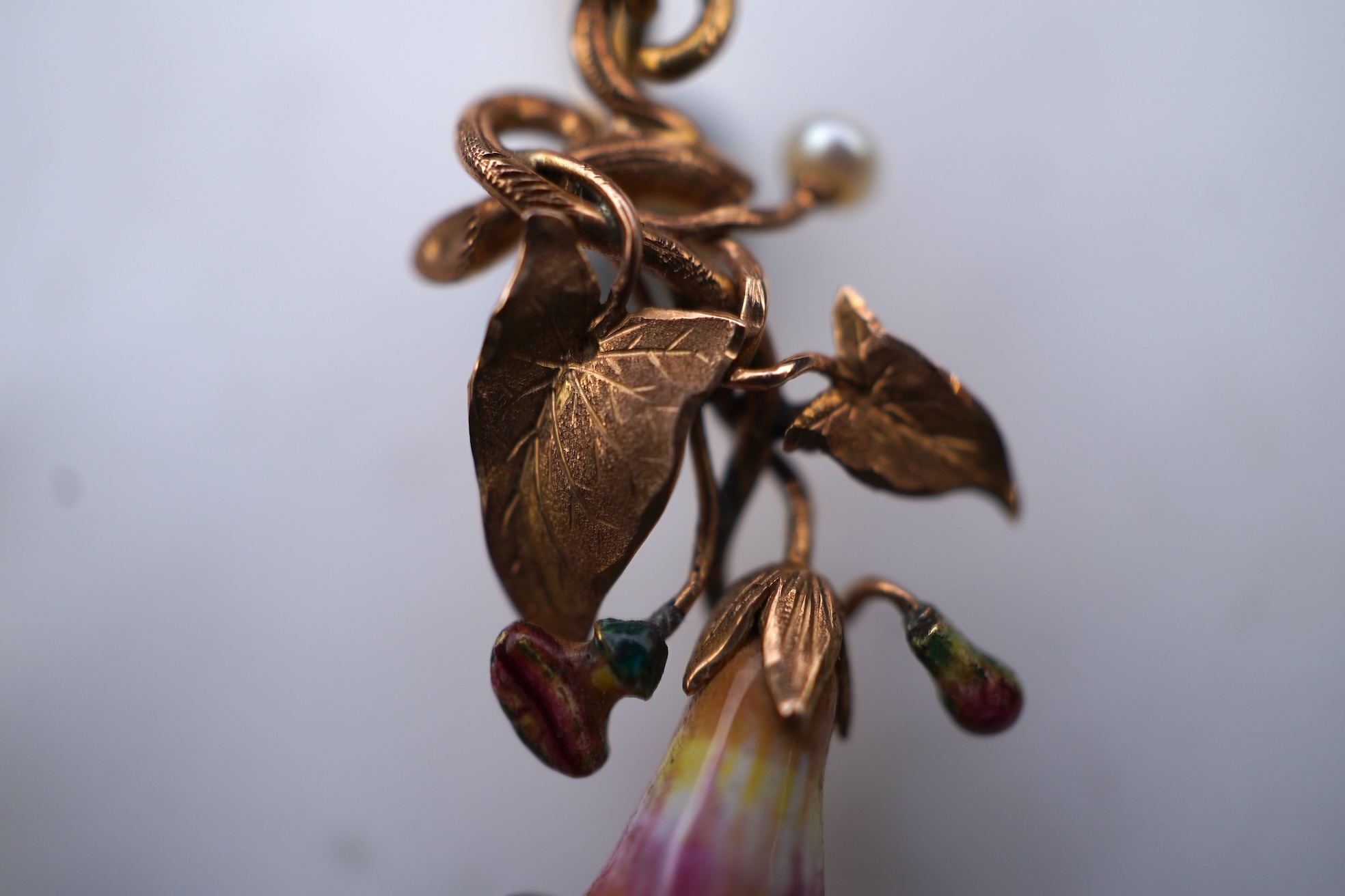 A rare pair of naturalistic gold, enamel and seed pearl earrings, circa 1850